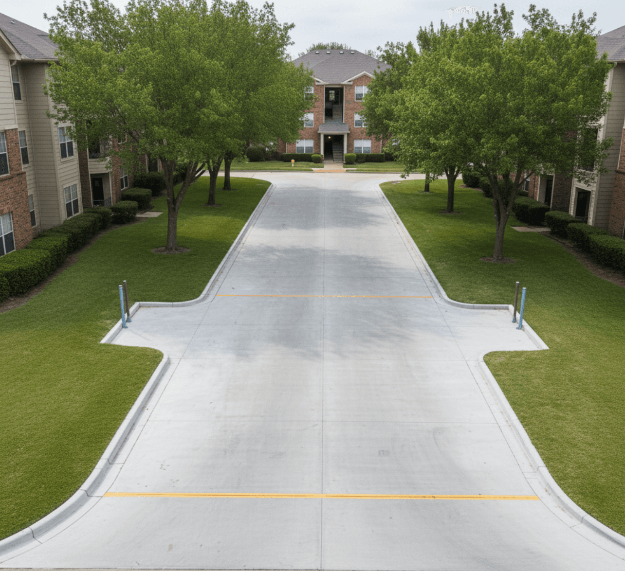 Rebuilt apartment driveway with smooth asphalt and striping in Spring Texas