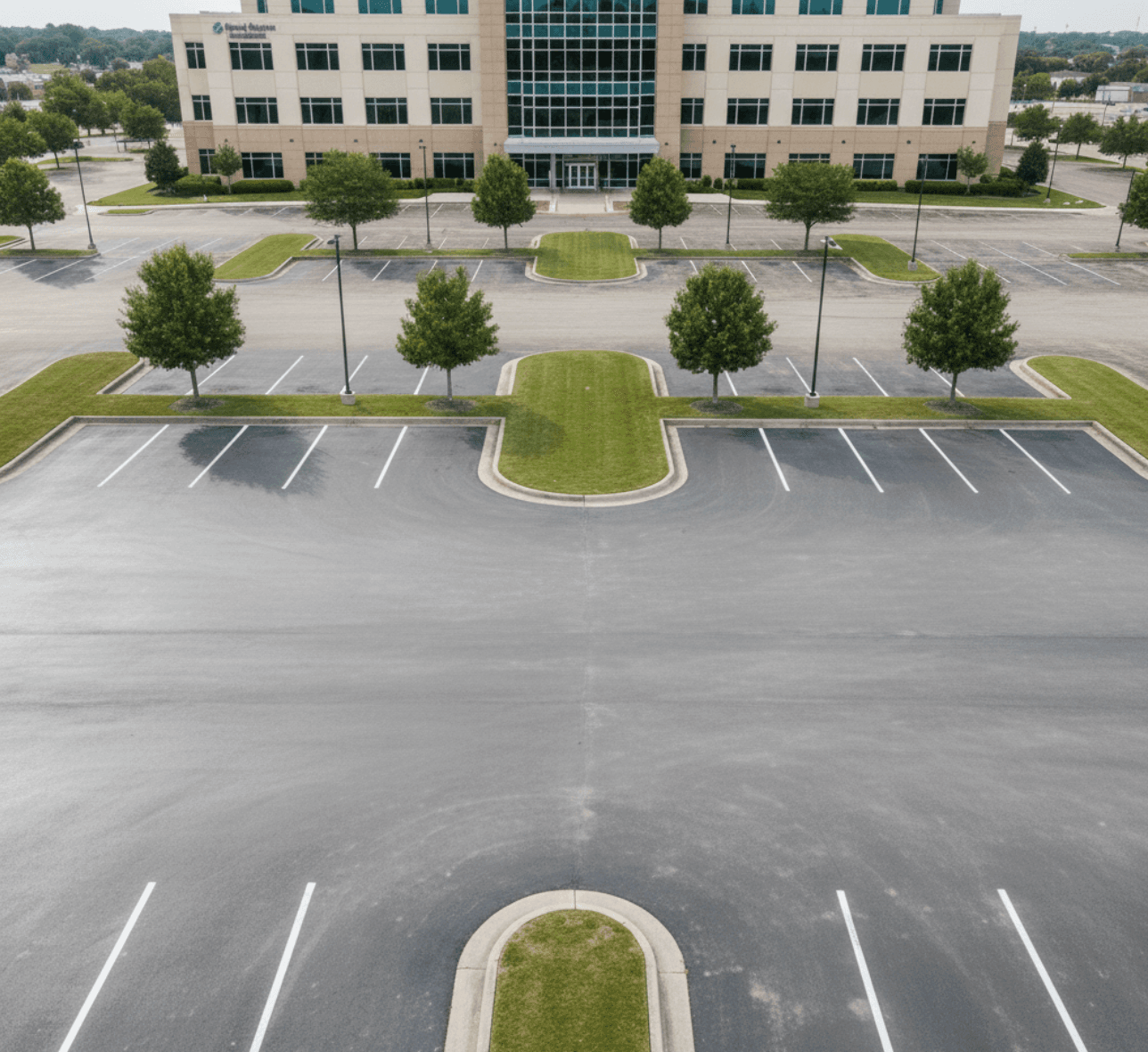 Freshly sealcoated medical campus lot with bright striping in Sugar Land